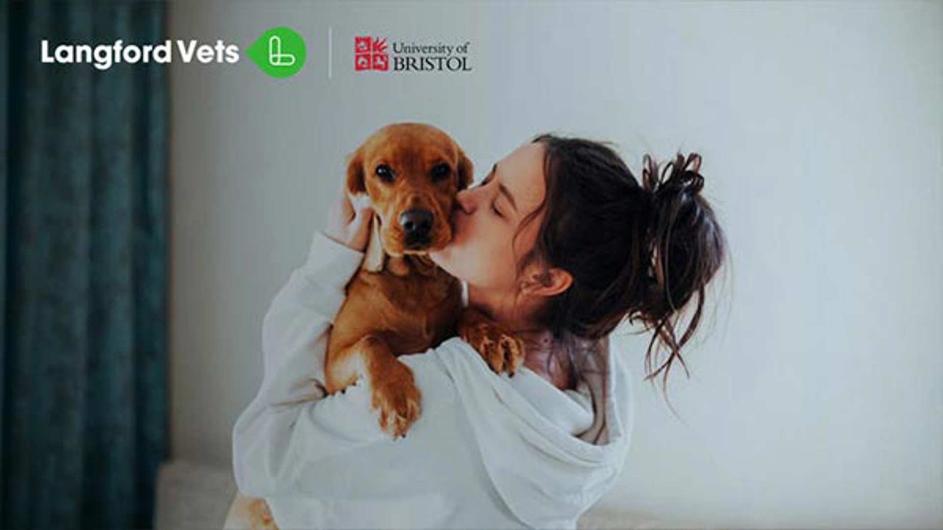 Woman hugging and kissing dog